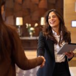 businesswomen shaking hands at hotel